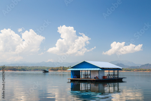 House in lake blue sky