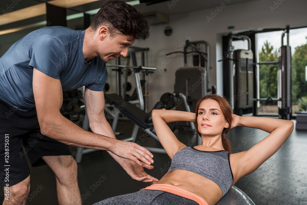 happy cutie athletic girl , execute exercise in sport-hall happy cutie athletic girl , execute exercise in sport-hall