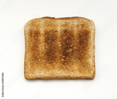 Slice of toasted bread isolated on white background. Close up. Top view