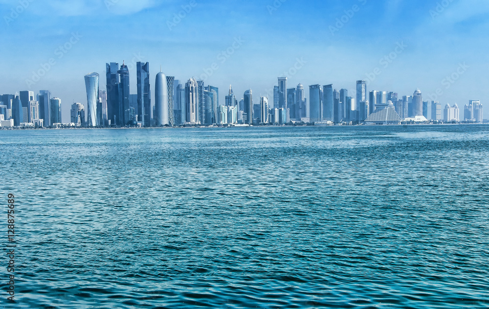 View of modern center Doha, Qatar with skyscrapers on skyline.Doha is the capital city and most populous city of the State of Qatar