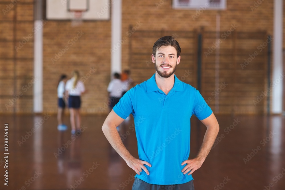 Fototapeta premium Portrait of sports teacher in basketball court
