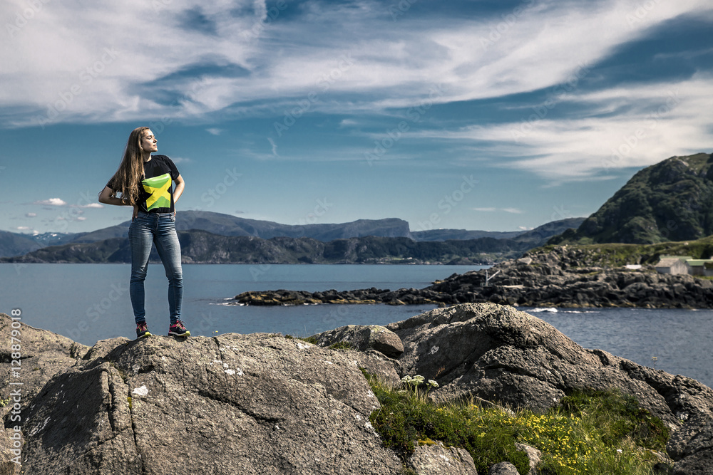 Young woman standing on the rocks, Norway
