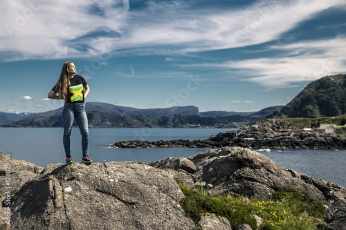 Young woman standing on the rocks, Norway