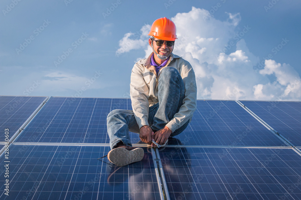 engineer or electrician working on maintenance equipment at industry solar power; engineer using thermal imager to check temperature heat of solar panel engineer or electrician working on maintenance equipment at industry solar power; engineer using thermal imager to check temperature heat of solar panel