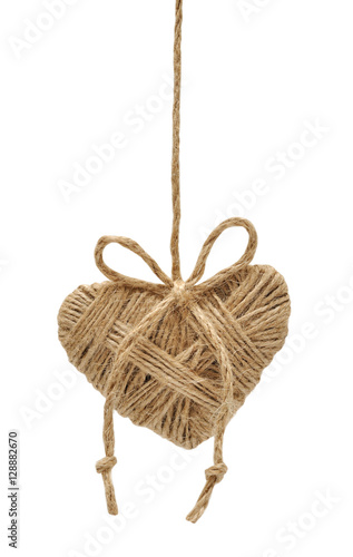 Heart decoration hanging on the ropes isolated on white backgrou