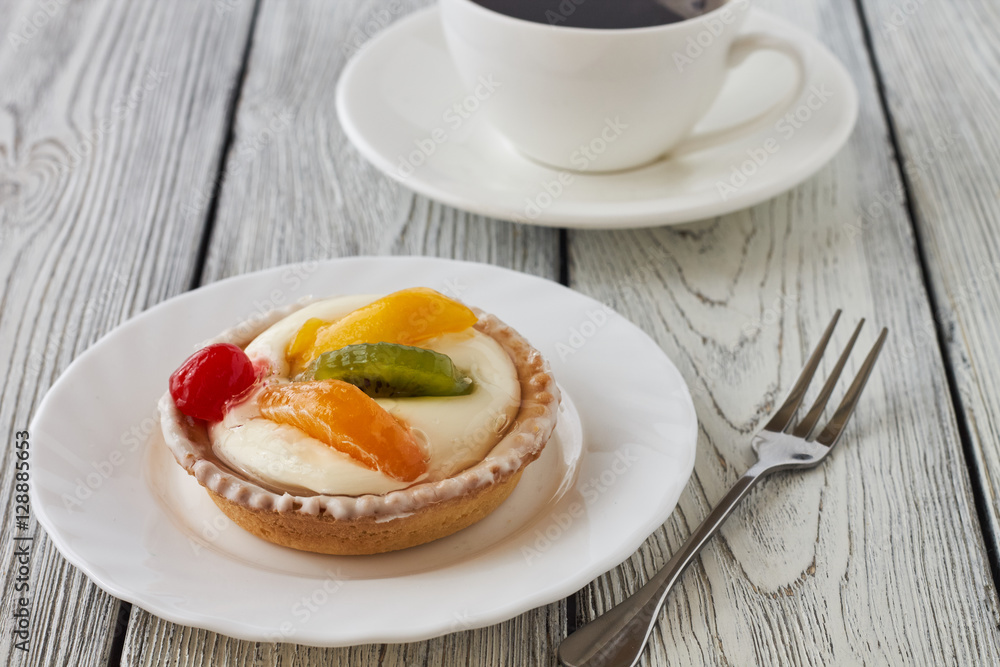 Tartlets with cream and fruits, orange, kiwi, cherry