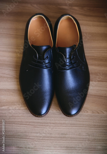 Men's shoes on wooden background