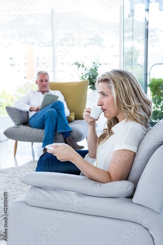 Woman having coffee at home