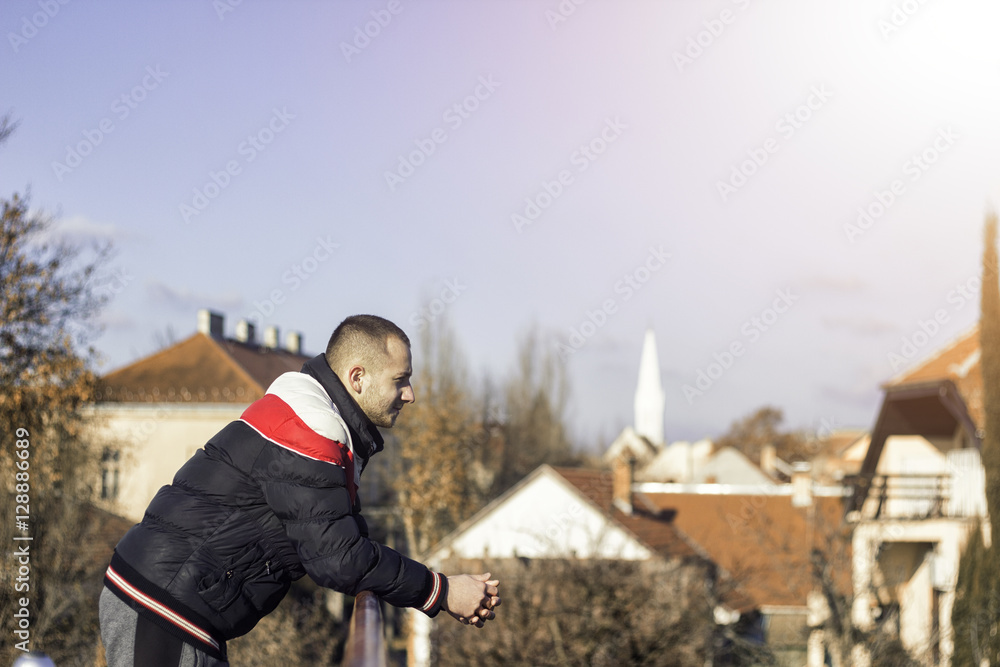 Young man looking out towards the horizon, a future concept Young man looking out towards the horizon, a future concept