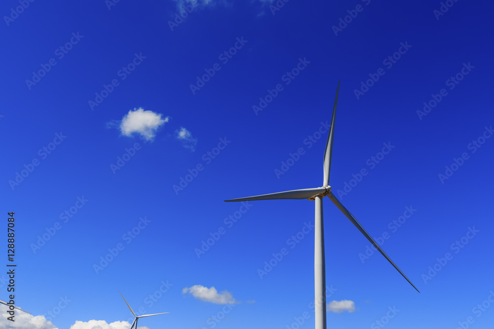 Wind turbine and white cloud in the blue sky. Wind turbine and white cloud in the blue sky.