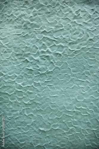 A full page of blue textured plaster wall background texture