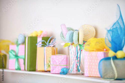 Closeup of colorful gifts box on shelf. Holyday decor