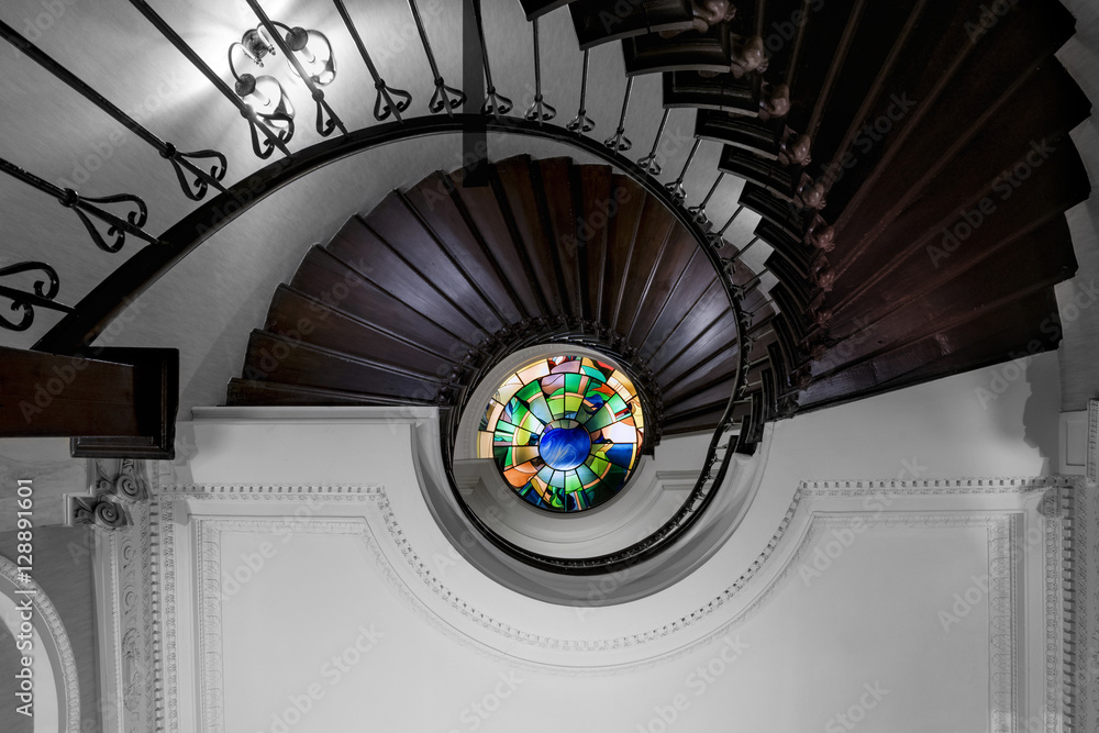 Fototapeta premium Old spiral staircase with wooden steps