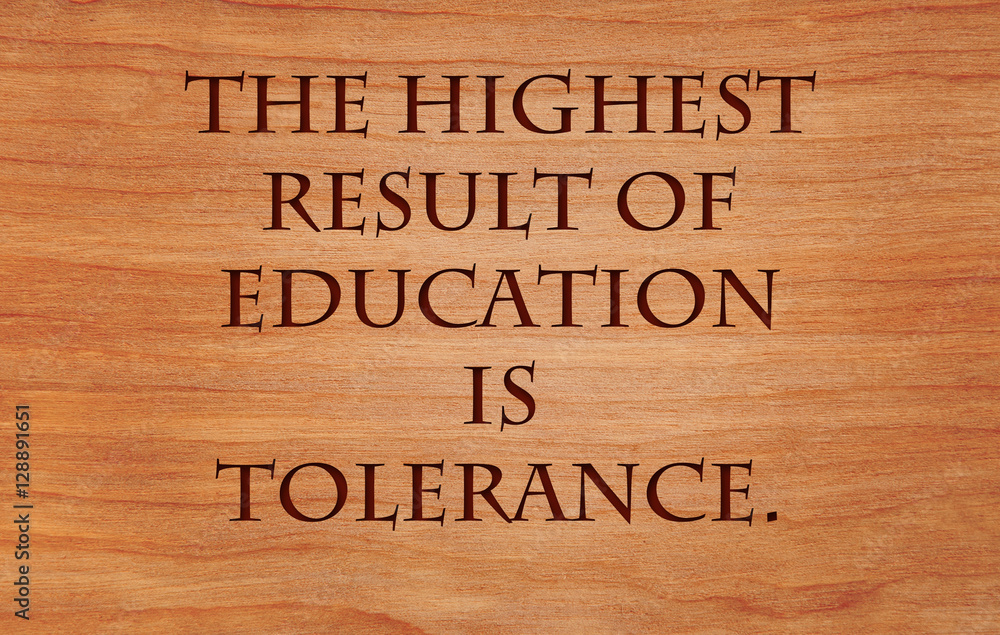 The highest result of education is tolerance - quote by Helen Keller on wooden red oak background