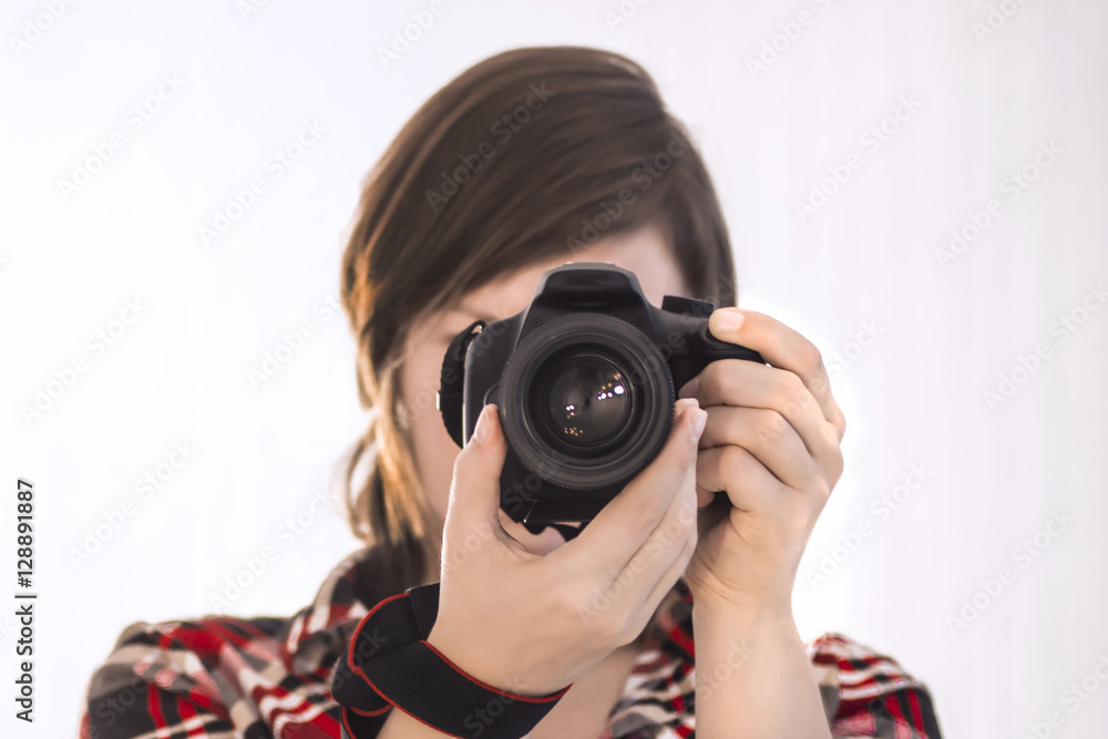 girl with camera on white background / photographer / cameraman / camerist girl with camera on white background / photographer / cameraman / camerist