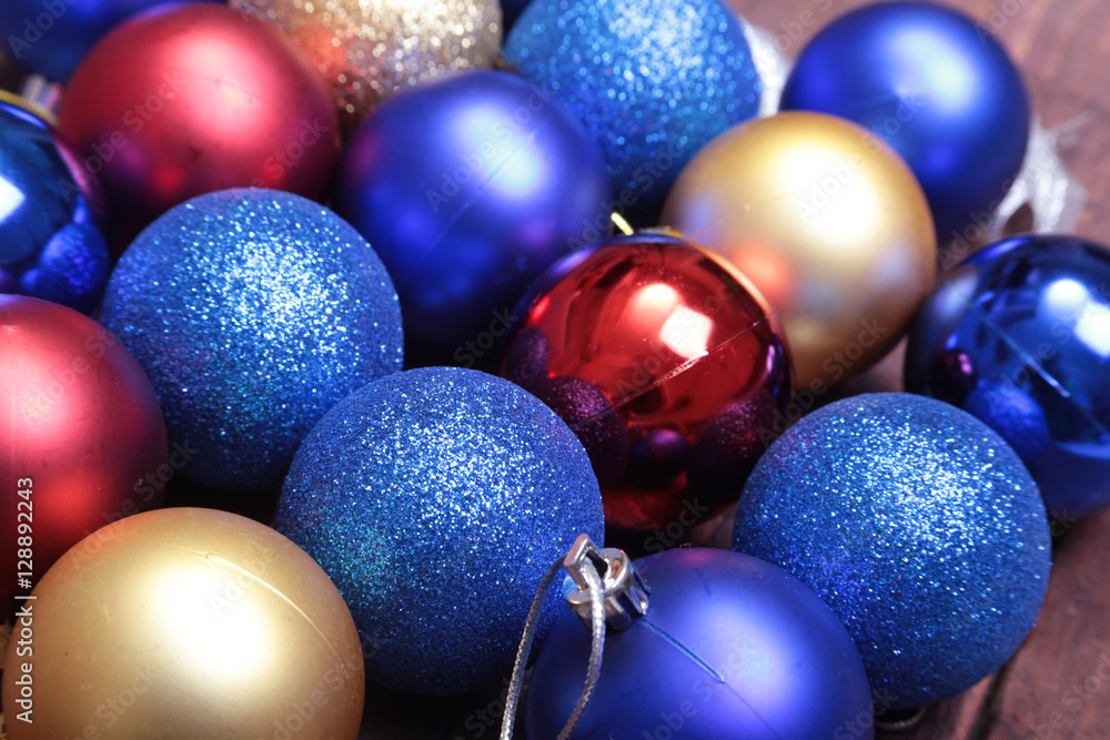 Blue and gold christmas balls on a wooden background Blue and gold christmas balls on a wooden background