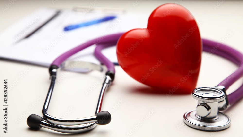 Heart with a stethoscope, isolated on white background Heart with a stethoscope, isolated on white background