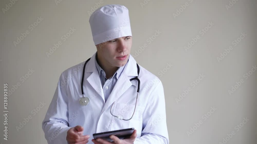 Thinking doctor working with tablet on background in 4K Thinking doctor working with tablet on background in 4K