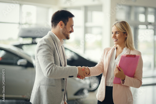 Salesperson workin at car dealership
