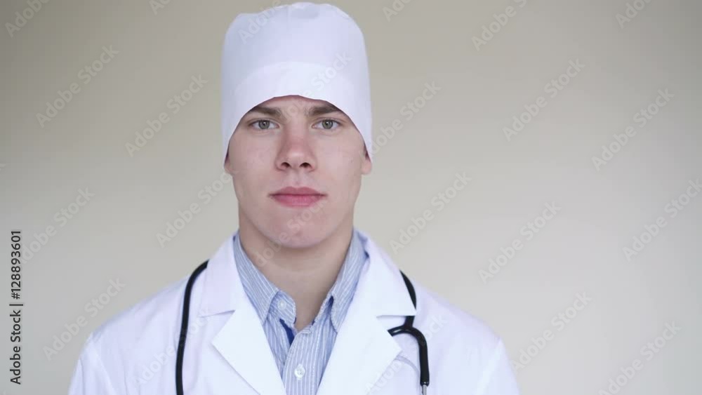 Portrait of a serious male doctor looking at camera in 4K Portrait of a serious male doctor looking at camera in 4K