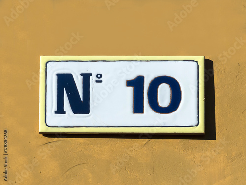 Street sign reading the number ten.