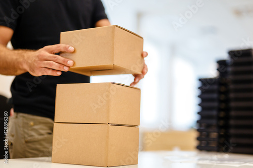 Packaging process before shipping © NDABCREATIVITY