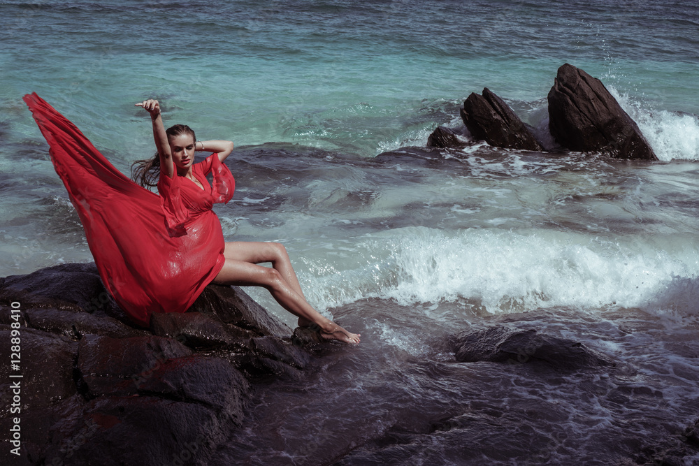Beautiful sensual glamour woman in flying red dress with wet hair ...