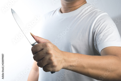 Принти на полотні A hand holding knife