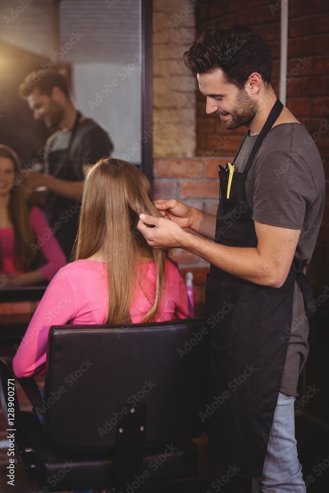 Handsome hair stylist with client Handsome hair stylist with client