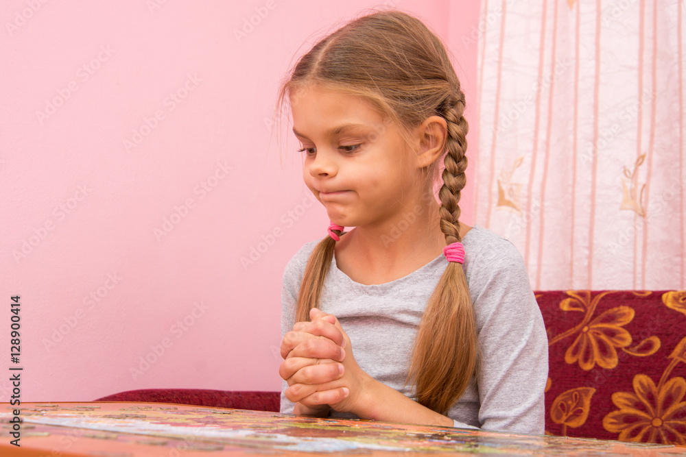 Girl funny thought pouting cheeks collecting picture of puzzles Girl funny thought pouting cheeks collecting picture of puzzles
