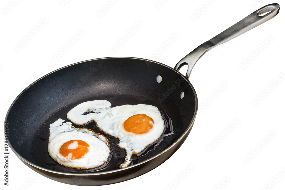 Sunny Side Up Eggs Fried In Old Heavy Duty Teflon Frying Pan Isolated On White Background Sunny Side Up Eggs Fried In Old Heavy Duty Teflon Frying Pan Isolated On White Background