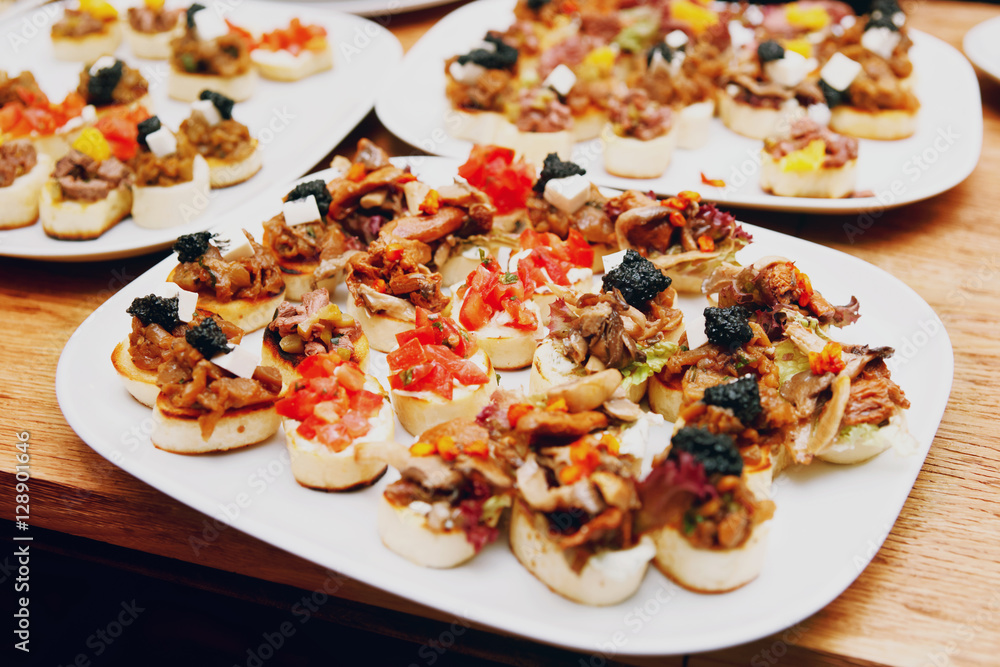 Bruschettas with meat and soft cheese, toned Bruschettas with meat and soft cheese, toned