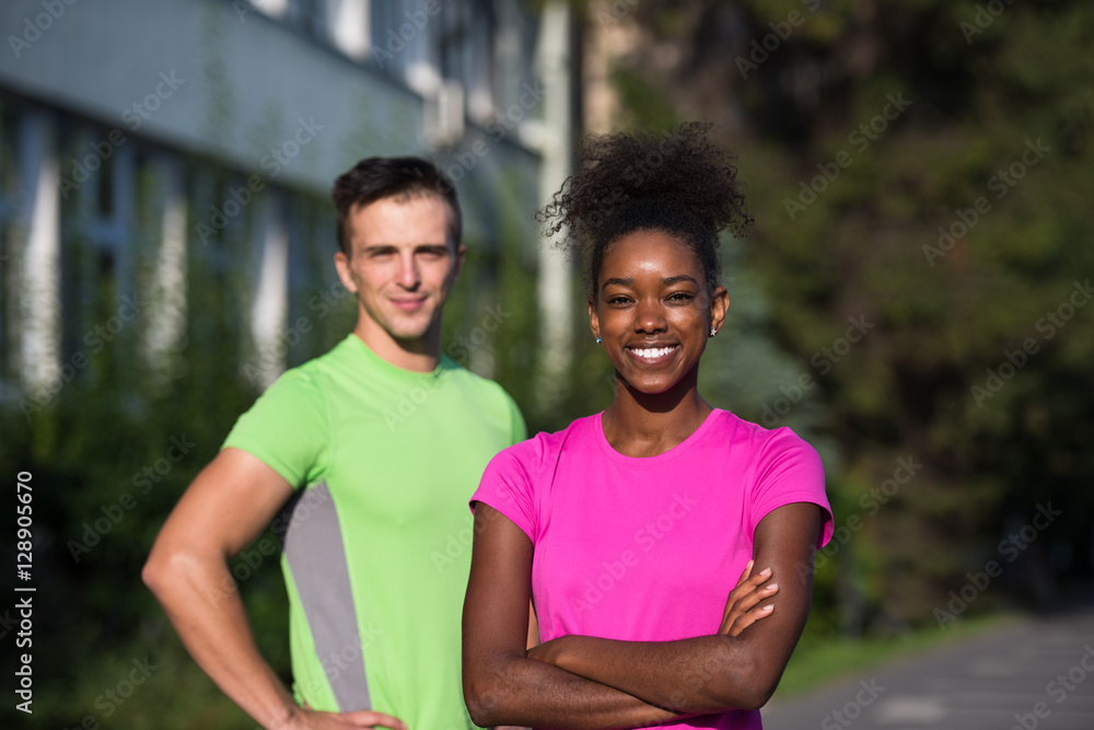 portrait of young multietnic jogging couple ready to run portrait of young multietnic jogging couple ready to run