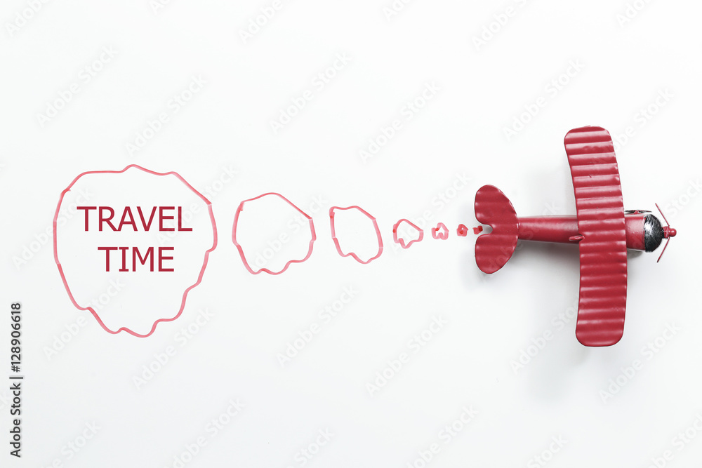 writing travel time red toy airplane with talk bubble on white background writing travel time red toy airplane with talk bubble on white background