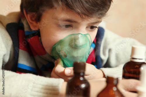preteen boy with electric inhaler