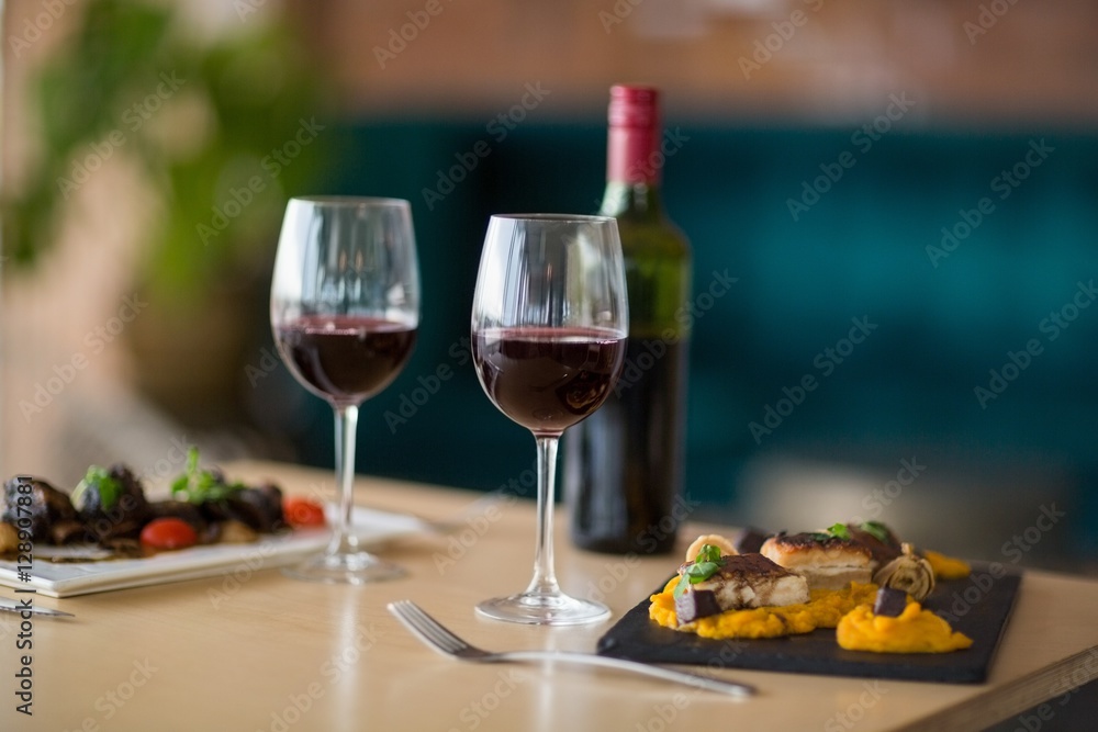 Plate of meal with glass of red wine Plate of meal with glass of red wine