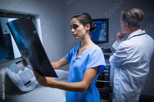 Nurse examining a x-ray