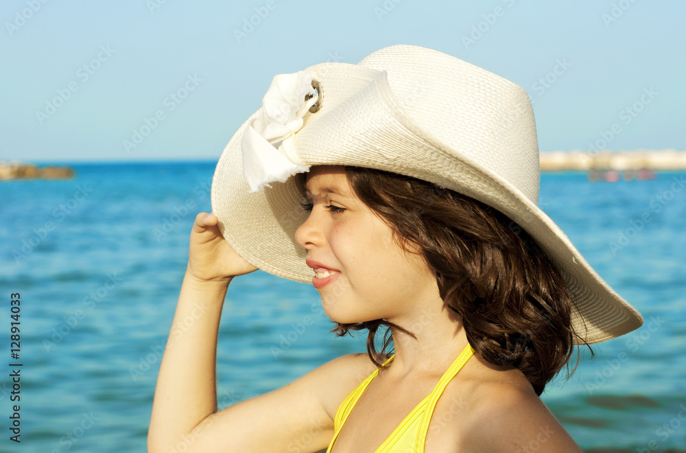 Gierl wearing a hat on the beach Gierl wearing a hat on the beach