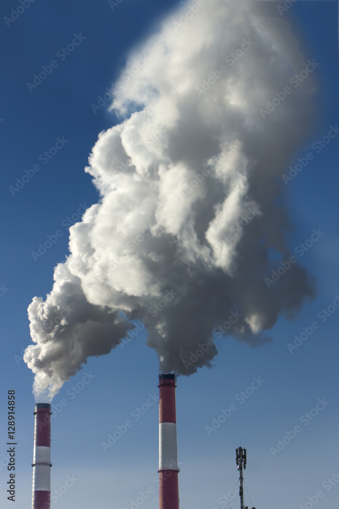 Thick smoke from factory chimneys. Pipe with smoke. Heat energy Thick smoke from factory chimneys. Pipe with smoke. Heat energy