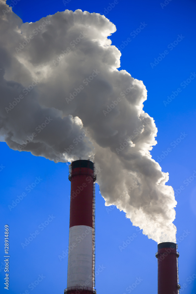 Thick smoke from factory chimneys. Pipe with smoke. Heat energy Thick smoke from factory chimneys. Pipe with smoke. Heat energy
