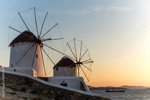 Amazing Sunset and White windmills on the island of Mykonos, Cyclades, Greece