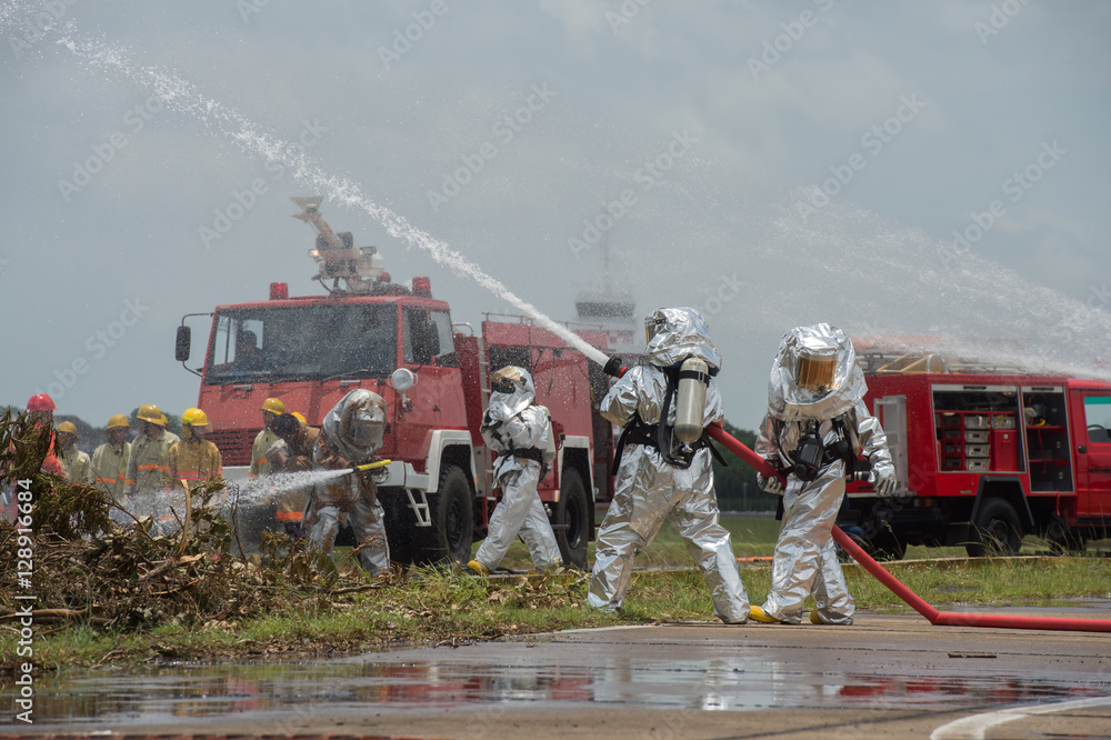 Obraz premium Fire departments & emergency response teams suited up with PPE t