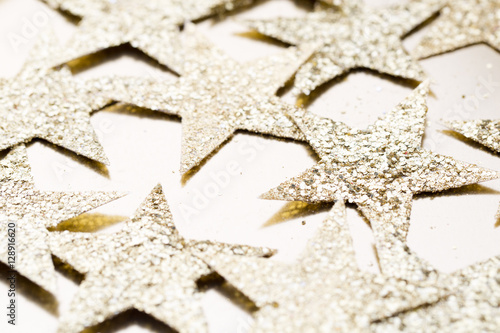 Christmas gold stars decoration on abstract background.