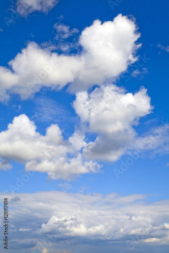 Fototapeta Naklejka Na Ścianę i Meble -  Blue sunny sky with puffy clouds