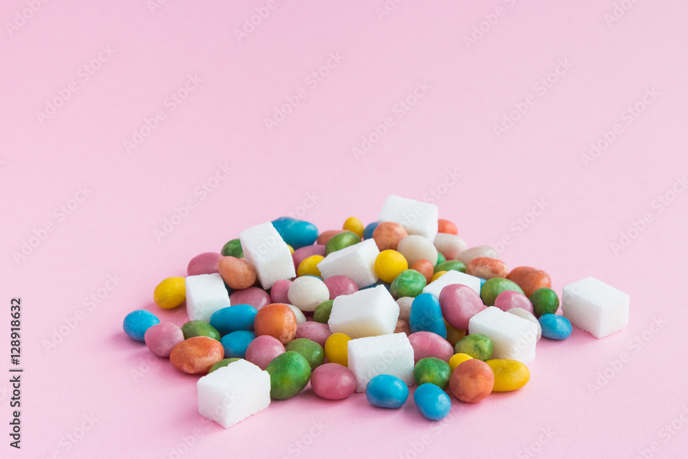 Sweets and sugar scattered on pink background Sweets and sugar scattered on pink background
