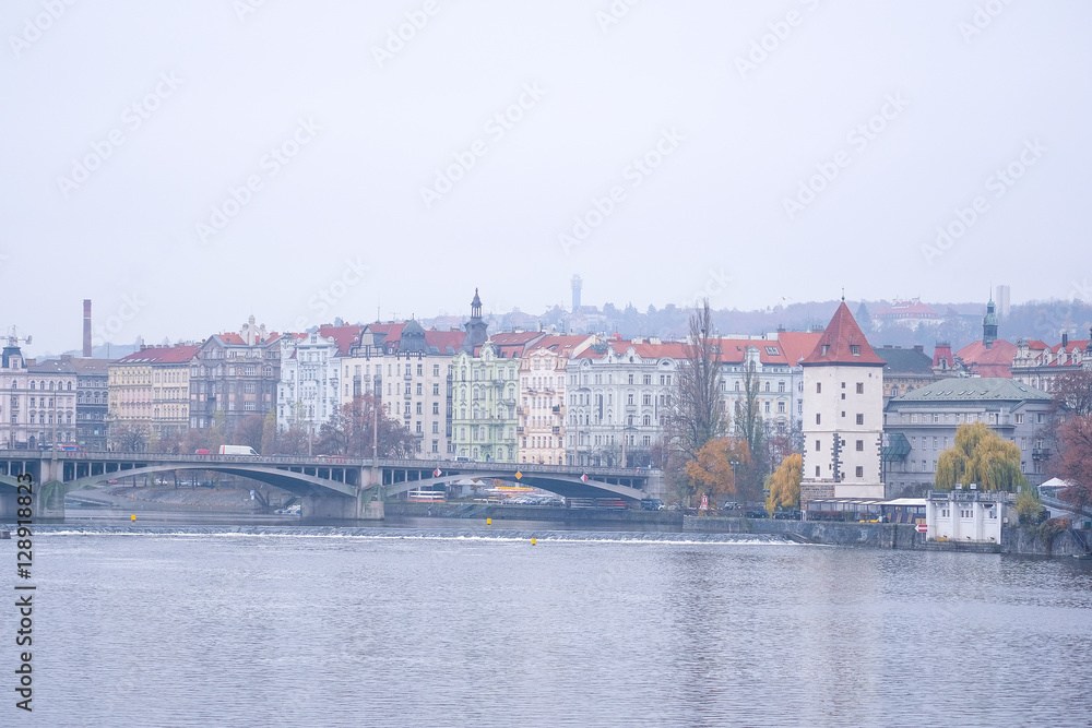 Prague, Czechia - November, 24, 2016: panorama of an old Prague, bridges and embankment of Vitava river, Czechia