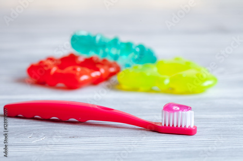 children s toothbrush oral care on wooden background