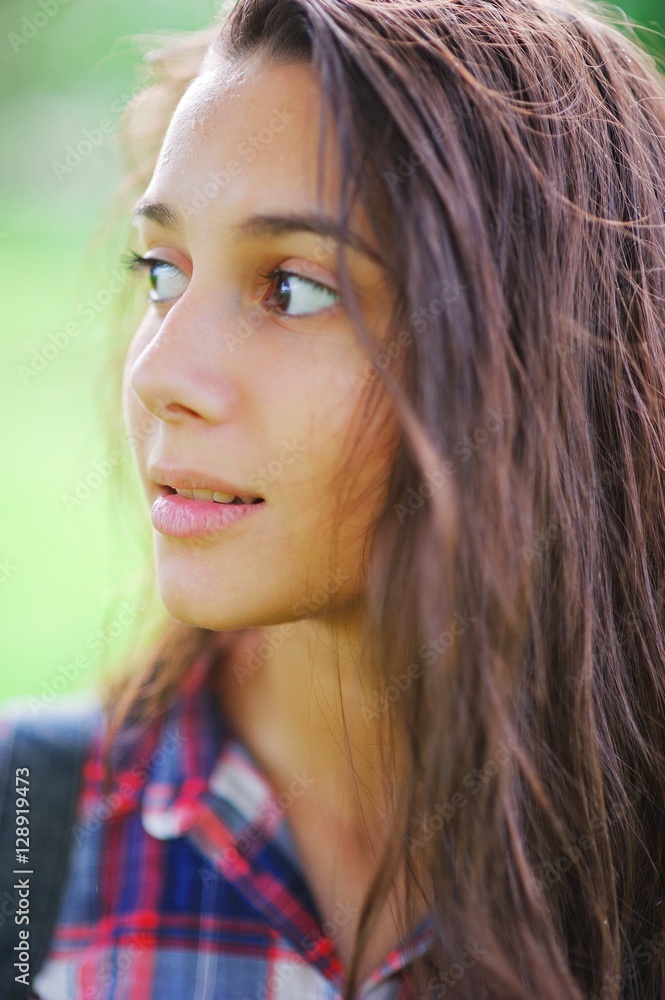 Portrait of cute girl in shirt in the box with wet hair after the rain on the street, closeup Portrait of cute girl in shirt in the box with wet hair after the rain on the street, closeup
