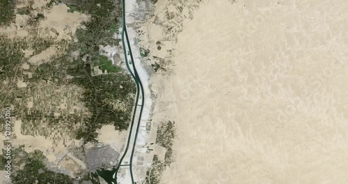 High-altitude overflight aerial of a portion of the Suez Canal adjacent to Al Qantara. Clip loops and is reversible. Elements of this image furnished by USGS/NASA Landsat 
