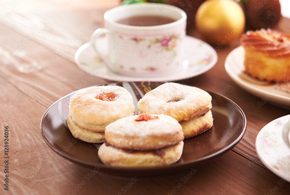tea and sweets on a wooden table tea and sweets on a wooden table
